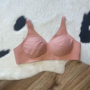 Knix Revolution V-Neck Bra in a peach/dusty pink color